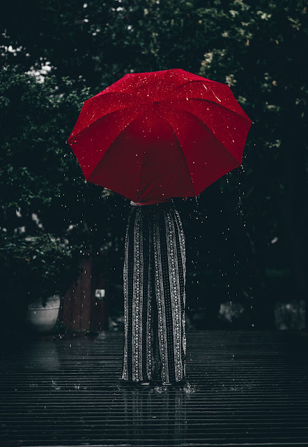 A red umbrella representing red flags in relationships.